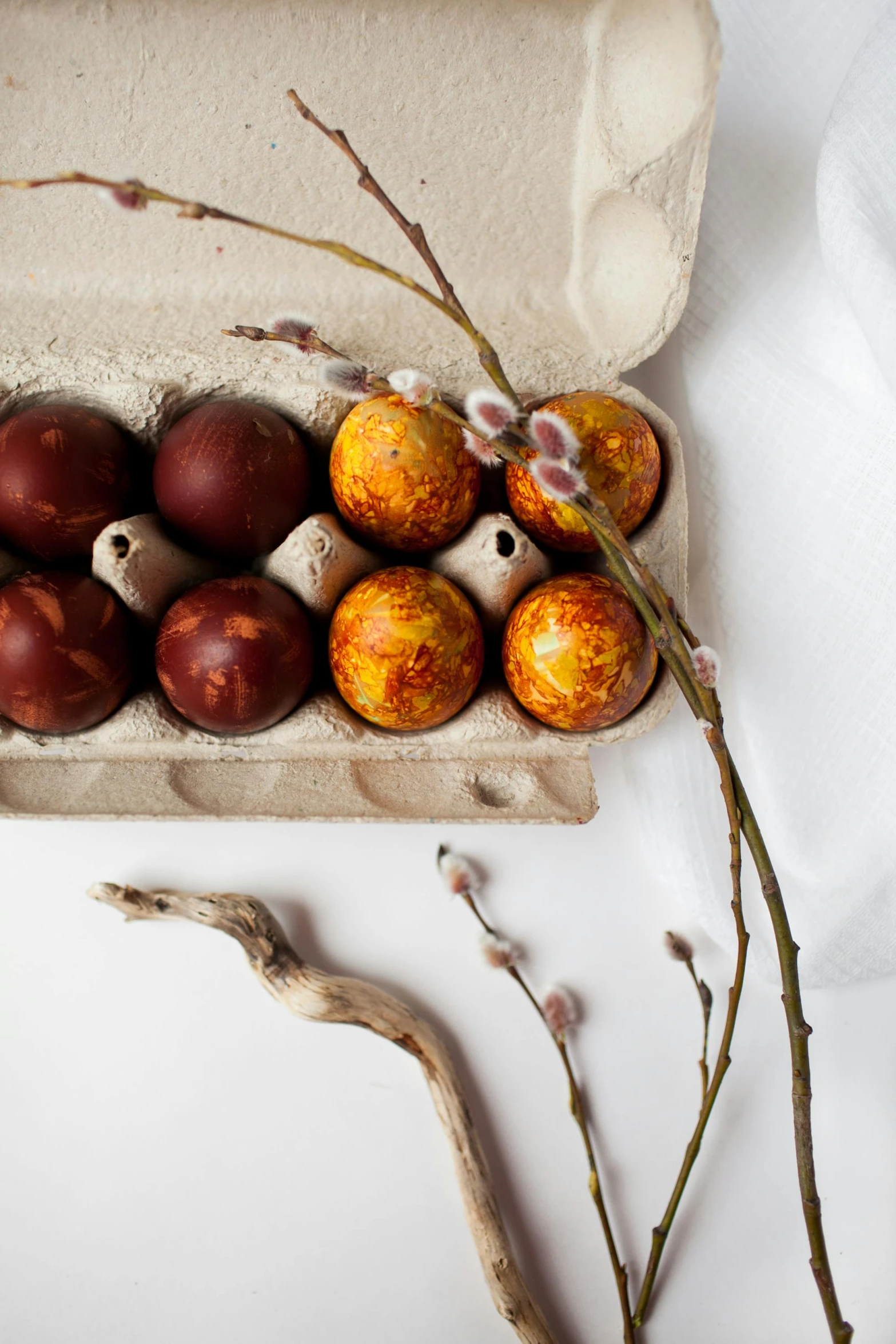 a carton filled with eggs sitting on top of a table, a still life, trending on unsplash, baroque, burnt sienna and venetian red, candy decorations, “ iron bark, close-up product photo