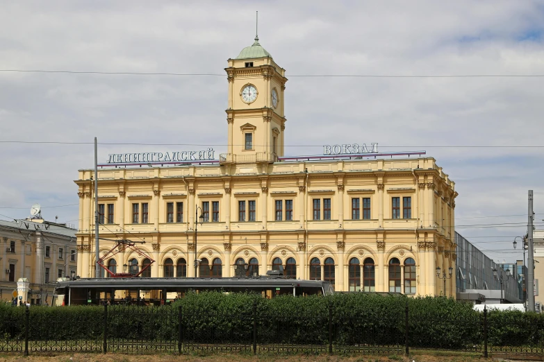 a large yellow building with a clock tower, inspired by Christoffer Wilhelm Eckersberg, station, saint petersburg, exterior photo, square