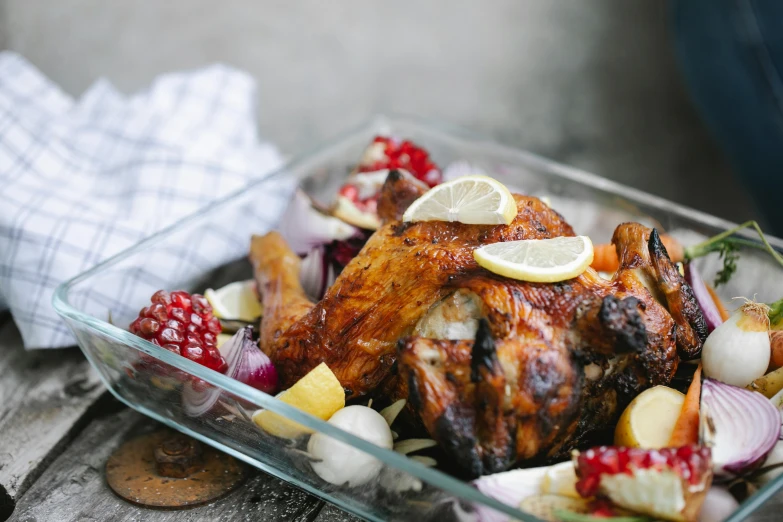 a close up of a plate of food on a table, chicken on top of a car, pomegranade, background image, thumbnail