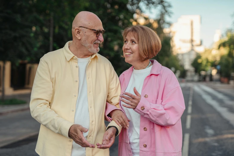 a man and woman standing next to each other on a street, pexels contest winner, hide the pain harold, avatar image, bald, profile image