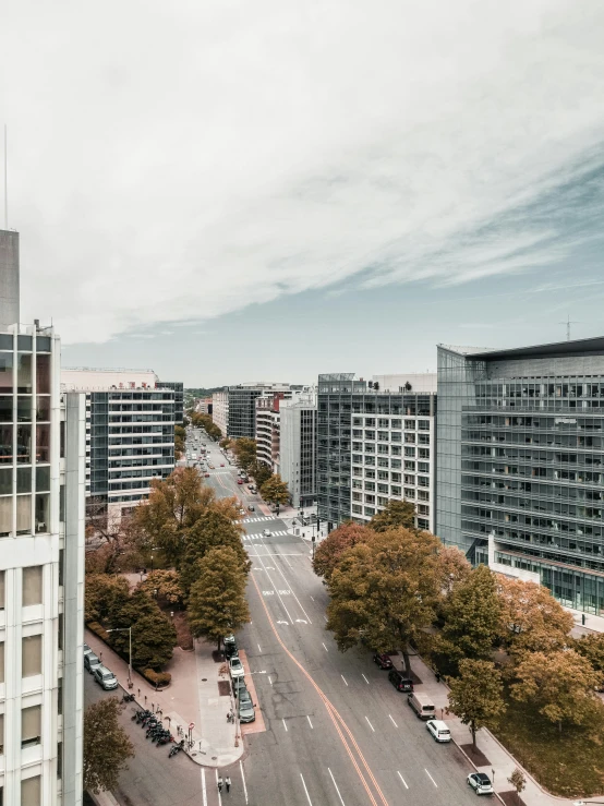 a city street filled with lots of tall buildings, unsplash contest winner, berlin secession, wellington, 4 k cinematic panoramic view, highly detailed photo 4k, no trees ， hyper detailed