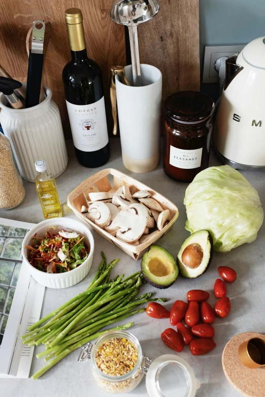 a counter topped with lots of different types of food, a still life, by Carey Morris, unsplash, good housekeeping, salad and white colors in scheme, bottles of spices, 8 l