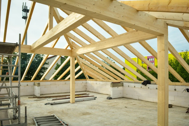 a picture of a building that is under construction, by Nick Fudge, unsplash, conceptual art, peaked wooden roofs, open top, vibrant volumetric natural light, portrait no. 1