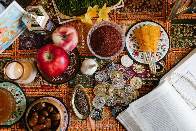 a table topped with lots of food and a book, by Meredith Dillman, pexels contest winner, qajar art, close up shot of an amulet, azamat khairov, full body image, high quality product image”