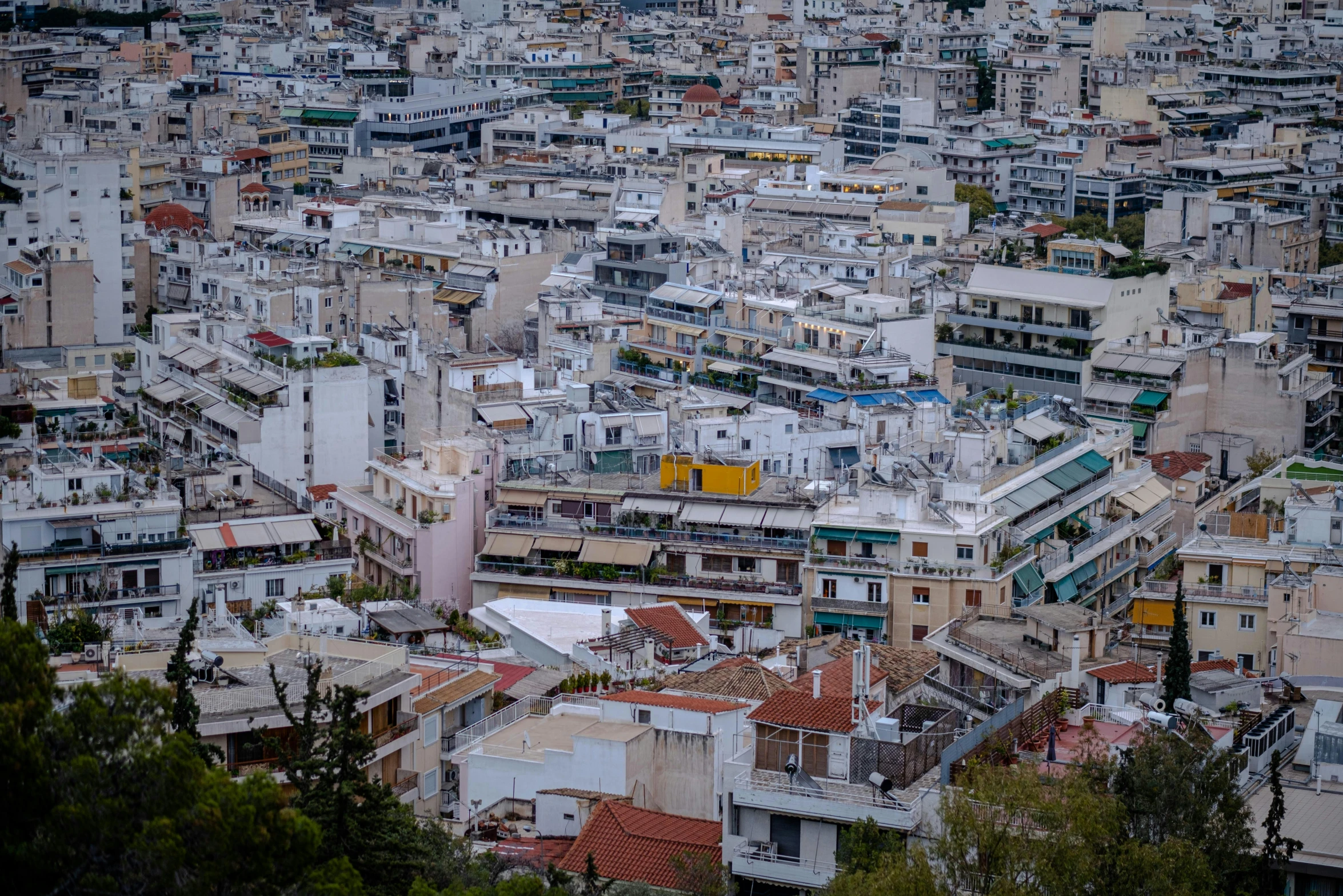 a view of a city from the top of a hill, by Niko Henrichon, pexels contest winner, neoclassicism, square, alexandros pyromallis, an overpopulated, brown