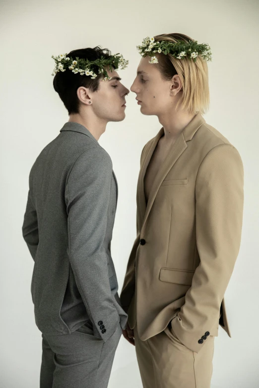 a couple of men standing next to each other, an album cover, by Ellen Gallagher, unsplash, renaissance, lesbian kiss, wearing suit, humanoids overgrown with flowers, pierre pellegrini and ash thorp