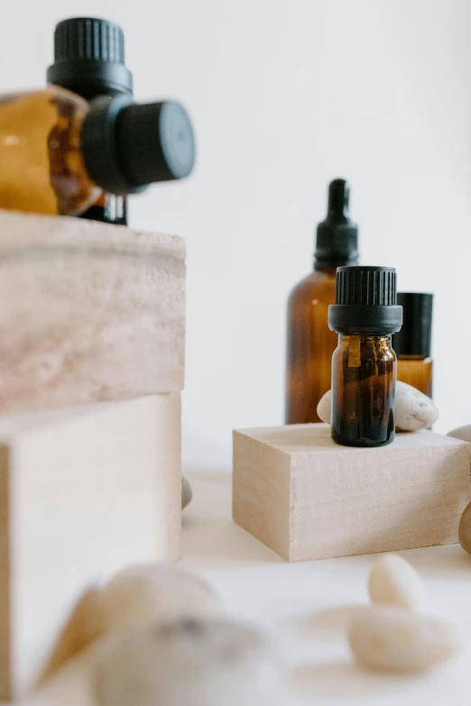 a couple of bottles sitting on top of a table, botanicals, product image, wooden platforms, thumbnail