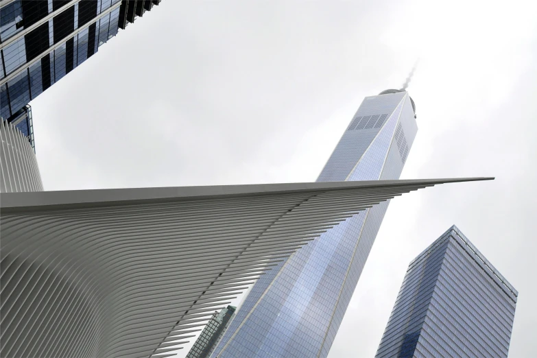 a couple of tall buildings sitting next to each other, an album cover, inspired by Zaha Hadid, pexels contest winner, steel blades, new york buildings, photograph credit: ap, world trade center twin towers