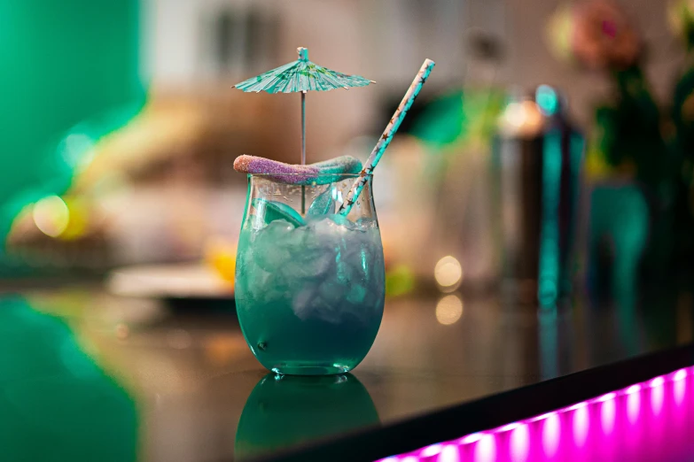 a blue drink sitting on top of a counter, turquoise and pink lighting, fan favorite, profile image, bar