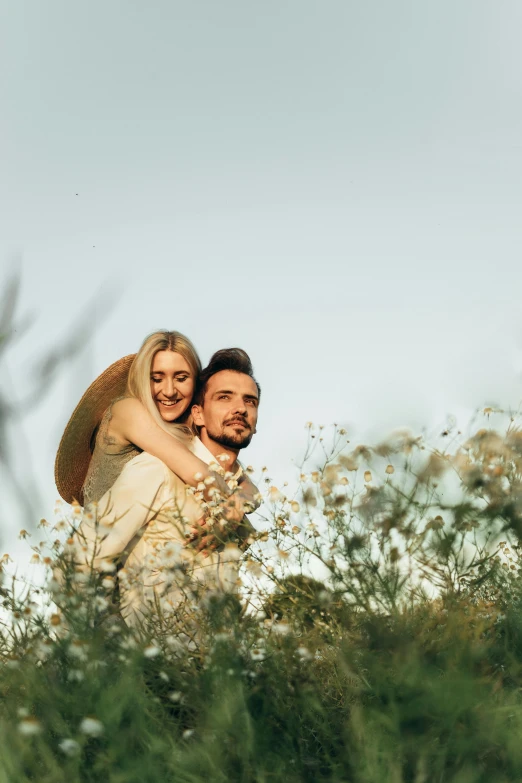 a man carrying a woman on his back in a field, pexels contest winner, with soft bushes, profile pic, plain background, clear and sunny