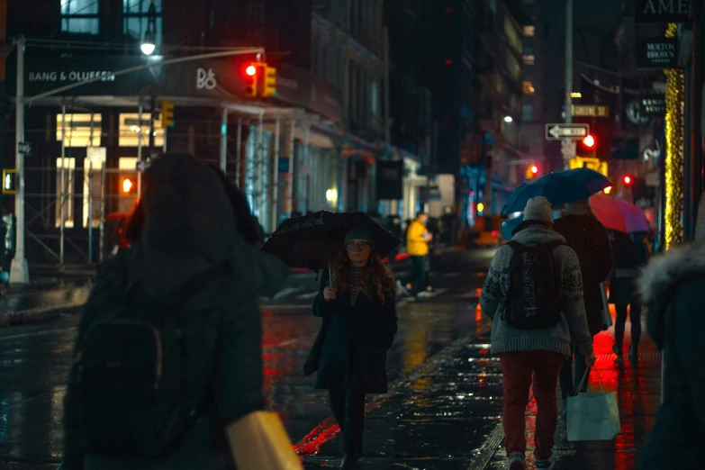 a group of people walking down a street at night, inspired by roger deakins, unsplash contest winner, photorealism, rainy day. game render, new york city, ps 4 in - game cinematic, graded with davinci resolve