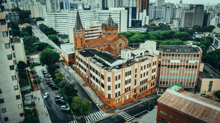 an aerial view of a city with tall buildings, a colorized photo, by Felipe Seade, pexels contest winner, churches, brick building, brazilian, private school