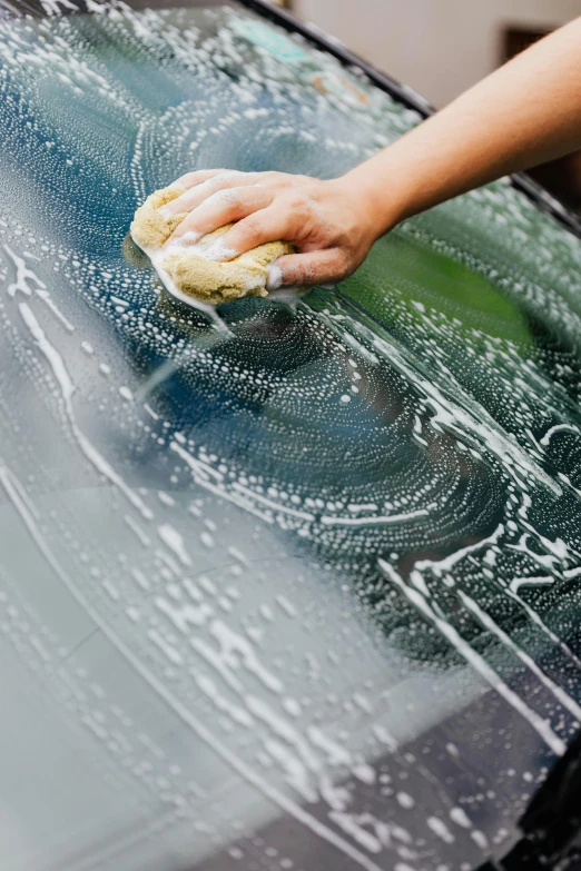 a person washing a car with a sponge, glazing, thumbnail, circular, superdetail