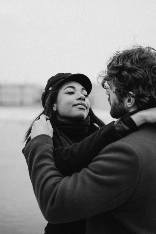 a black and white photo of a man hugging a woman, pexels contest winner, instagram post, dutch, profile picture, coastal