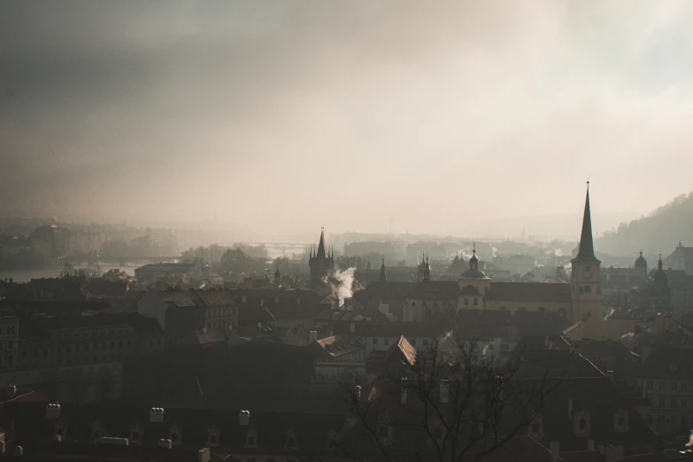 a view of a city from the top of a hill, by Adam Marczyński, pexels contest winner, baroque, light haze, moody shadows, old town