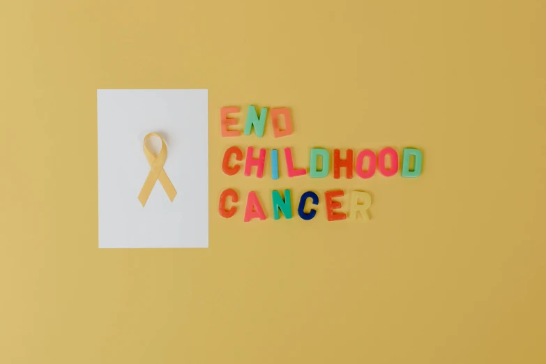 a piece of paper with the words end childhood cancer written on it, by Julia Pishtar, pexels contest winner, pop art, ribbons, paper quilling, childhood, background image