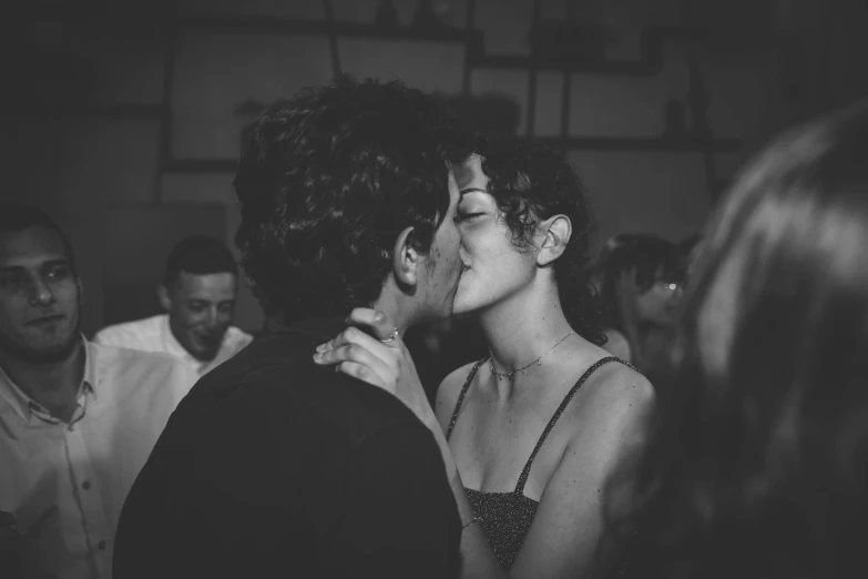 a black and white photo of a man kissing a woman, by Daniel Lieske, pexels, renaissance, at the party, curly haired, charli bowater and artgeem, blanca alvarez