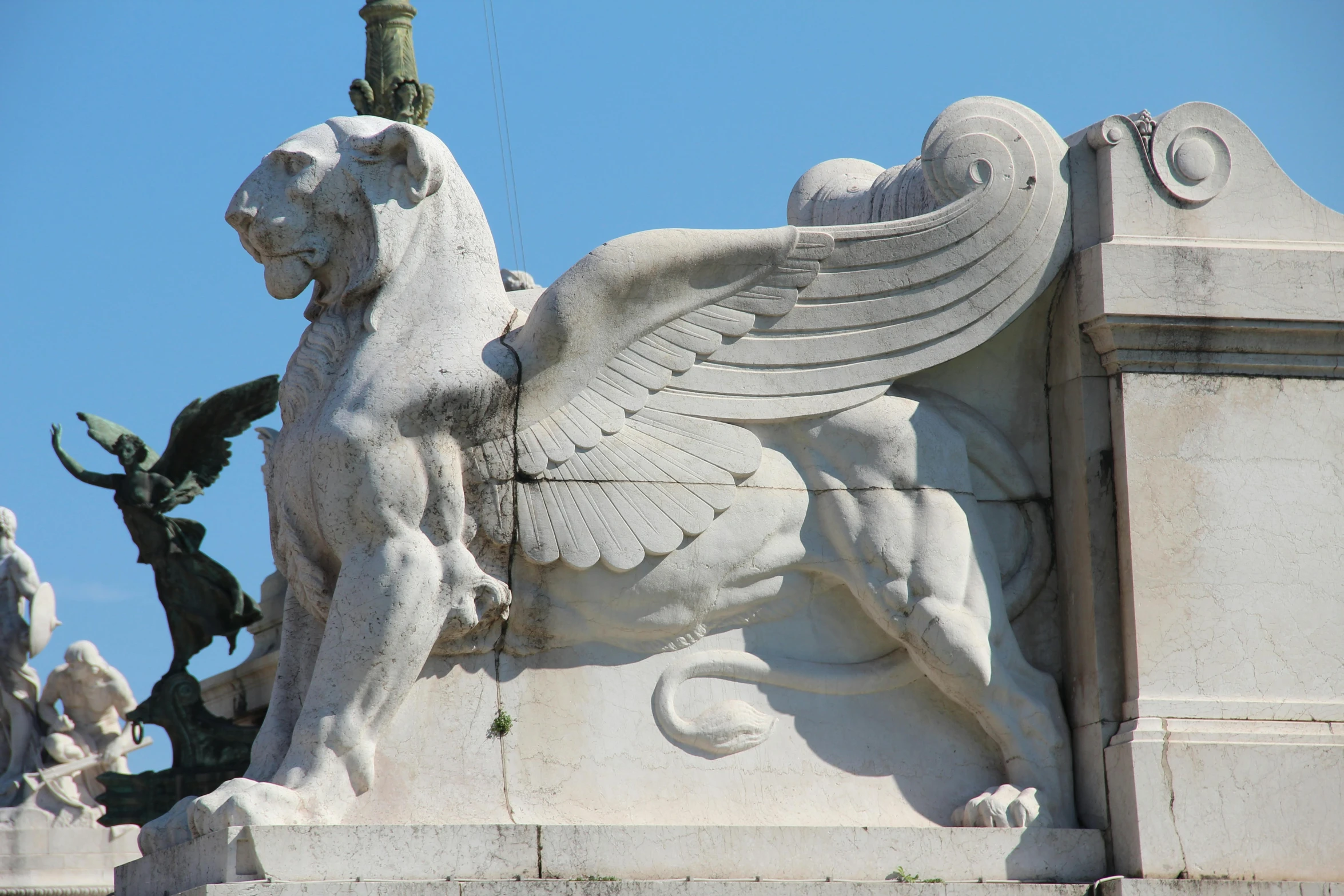 a statue of a winged lion on top of a building, by Cagnaccio di San Pietro, pexels contest winner, neoclassicism, venice, parapets, art noveau, carved white marble