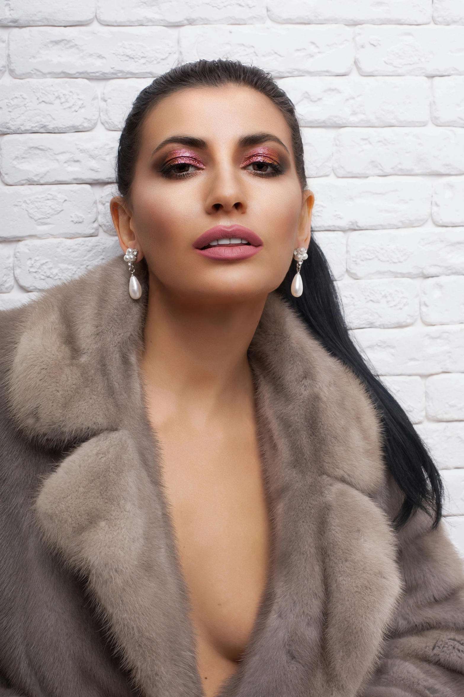 a woman in a fur coat posing for a picture, an album cover, inspired by Katerina Wilczynski, trending on pexels, renaissance, long earrings, meni chatzipanagiotou, silver，ivory, middle eastern