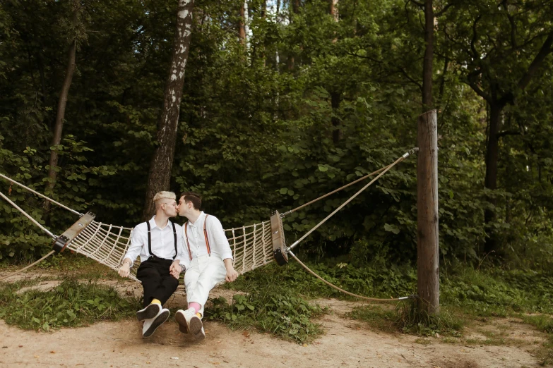 a couple of people that are sitting in a hammock, by Julia Pishtar, unsplash, romanticism, gay, wedding photo, 15081959 21121991 01012000 4k, cute boys