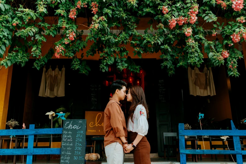 a man and woman standing in front of a restaurant, pexels contest winner, tachisme, romantic greenery, phong shaded, love is begin of all, background image