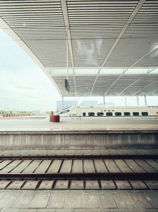 a man riding a skateboard up the side of a ramp, inspired by Fei Danxu, unsplash contest winner, hyperrealism, train station background, view out of a window, eurostar, bullet train