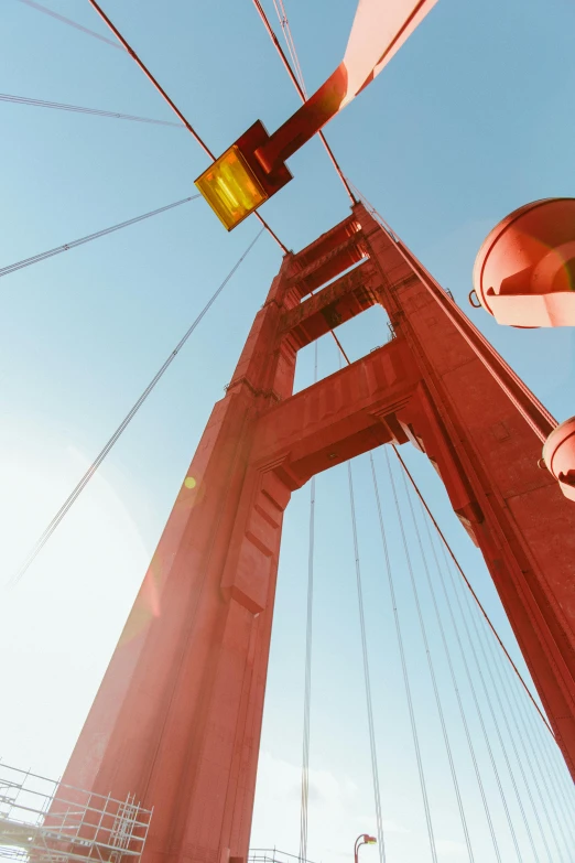 a view of the golden gate bridge from below, a picture, unsplash, modernism, slide show, color”