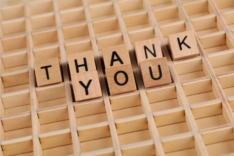 a wooden block that says thank you, a picture, by Arabella Rankin, shutterstock, square, from valve, 15081959 21121991 01012000 4k, figures