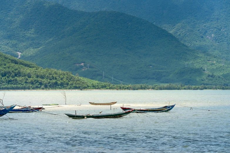 a group of boats floating on top of a lake, by Tom Wänerstrand, pexels contest winner, dau-al-set, phuoc quan, profile image, tsunami, panoramic