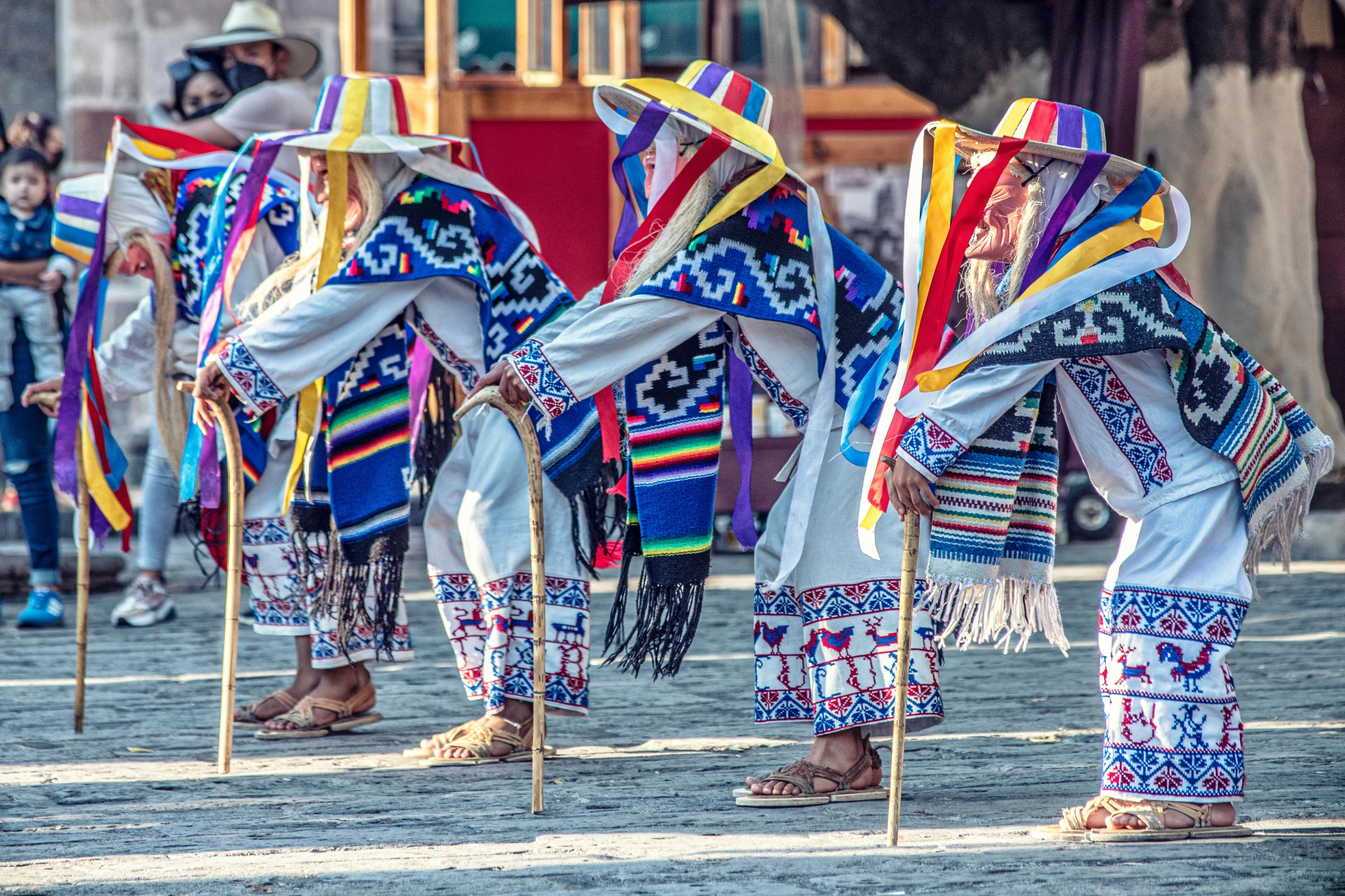 a group of people that are standing in the street, by Tom Wänerstrand, pexels contest winner, danza azteca dancers, square, covered in robes, multicolor