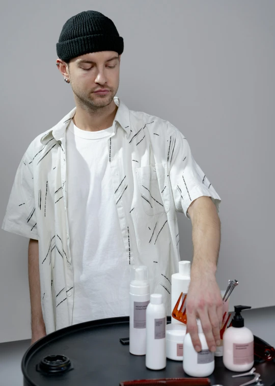 a man that is standing in front of a tray, by Vadym Meller, hair gel combed backwards, thumbnail, shirt, ilya ozornin