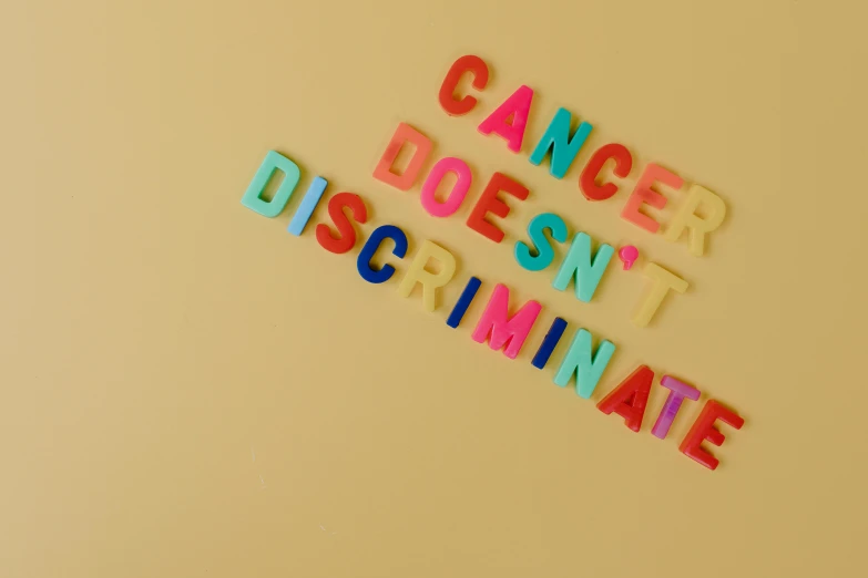 a sign that says cancer doesn't discriminate, a colorized photo, pexels, 8, decoration, roygbiv, 5