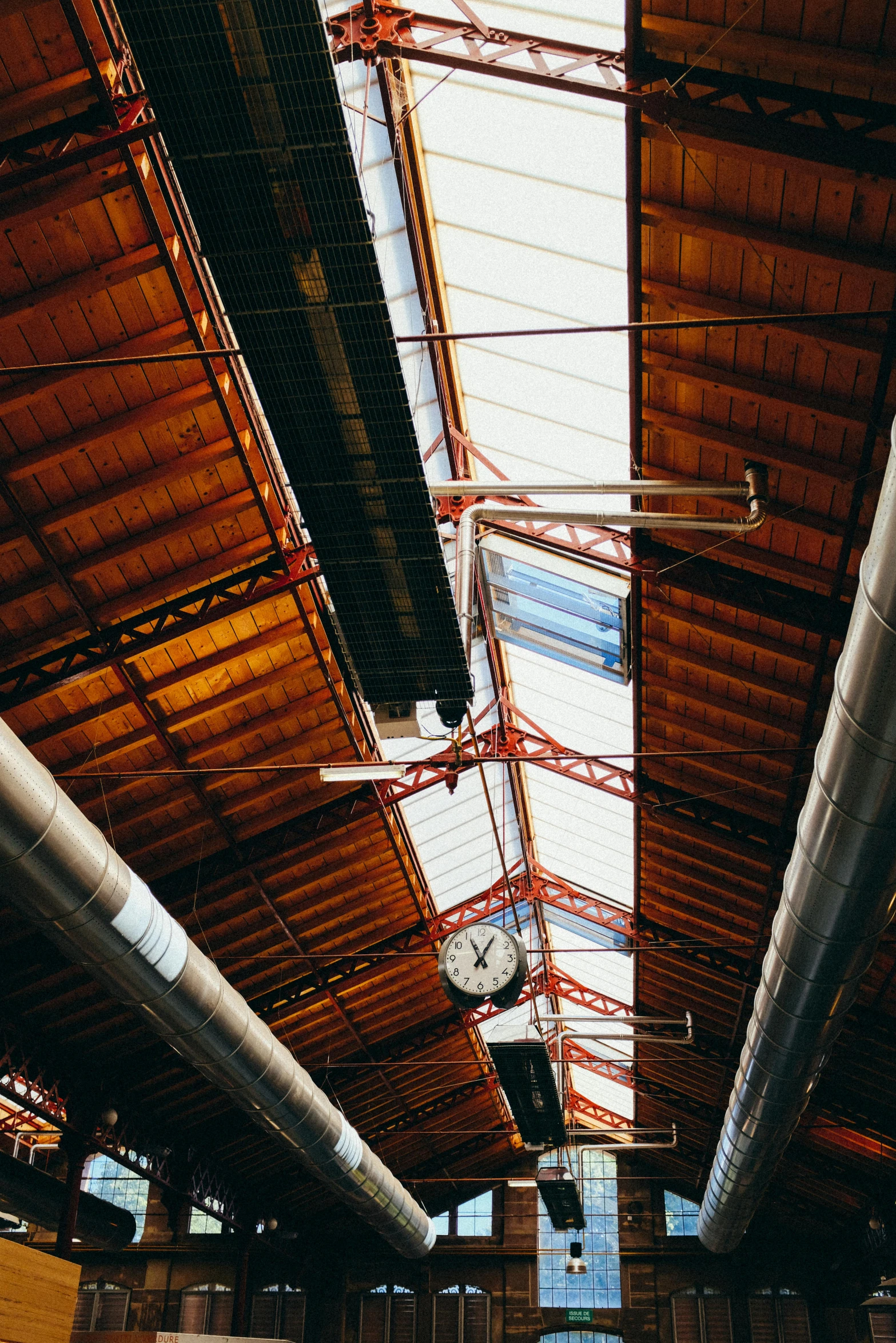 a train station with a clock on the ceiling, pexels contest winner, modernism, peaked wooden roofs, 2 5 6 x 2 5 6 pixels, industrial plant environment, inspect in inventory image