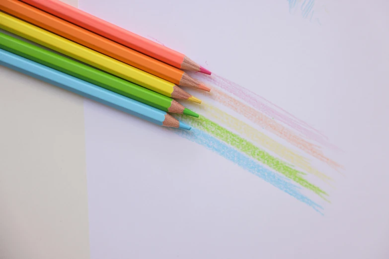 a group of colored pencils sitting on top of a piece of paper, a child's drawing, inspired by Gerard David, trending on pexels, process art, pastel neon, white sketch lines, mild colours, interesting angle