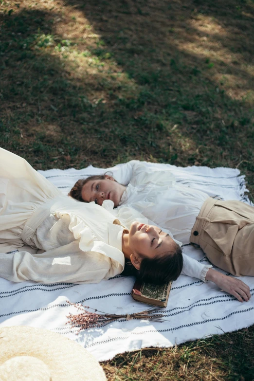 a couple of people laying on top of a blanket, renaissance, wearing a linen shirt, lush surroundings, ignant, vintage clothing