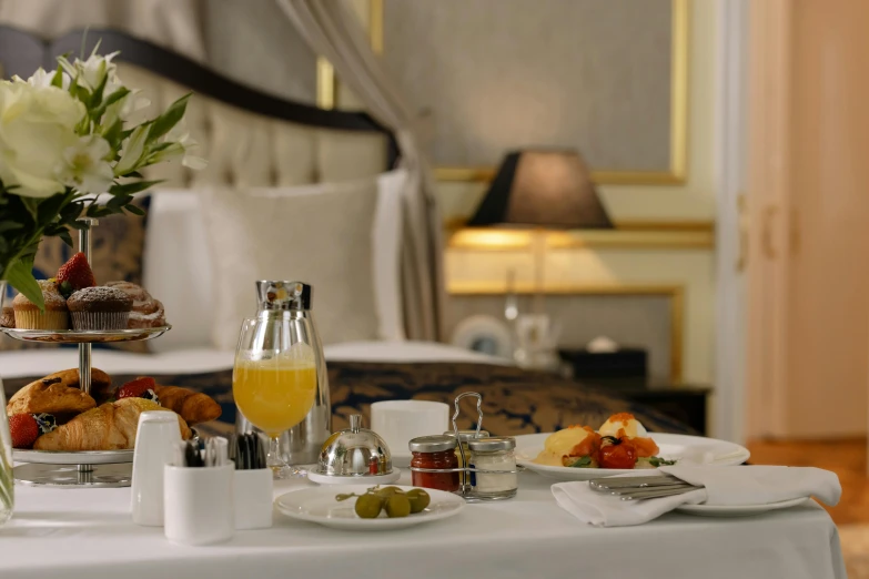 a tray of food sitting on top of a table, rococo, hotel room, grey, ameera al-taweel, breakfast