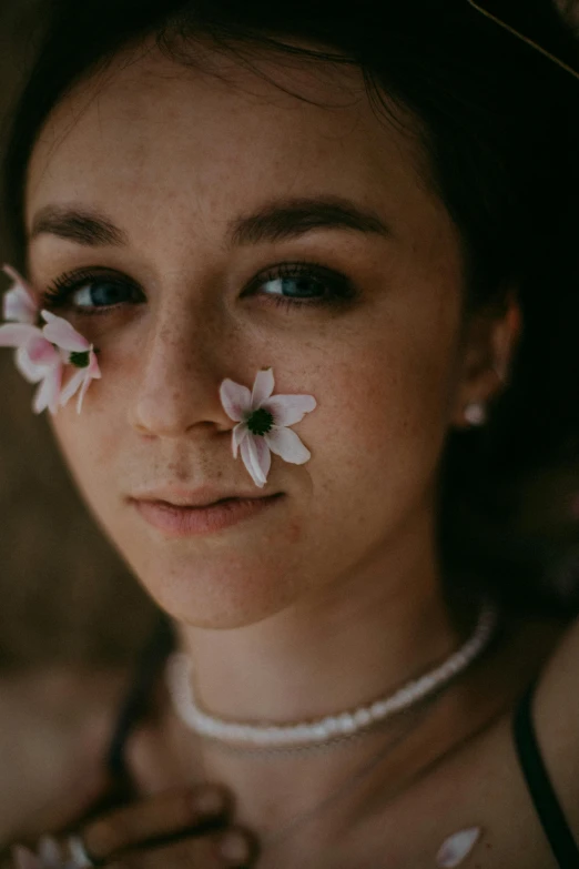 a close up of a woman with flowers on her face, trending on unsplash, portrait of white teenage girl, girl with a pearl earringl, looking towards camera, soft face features