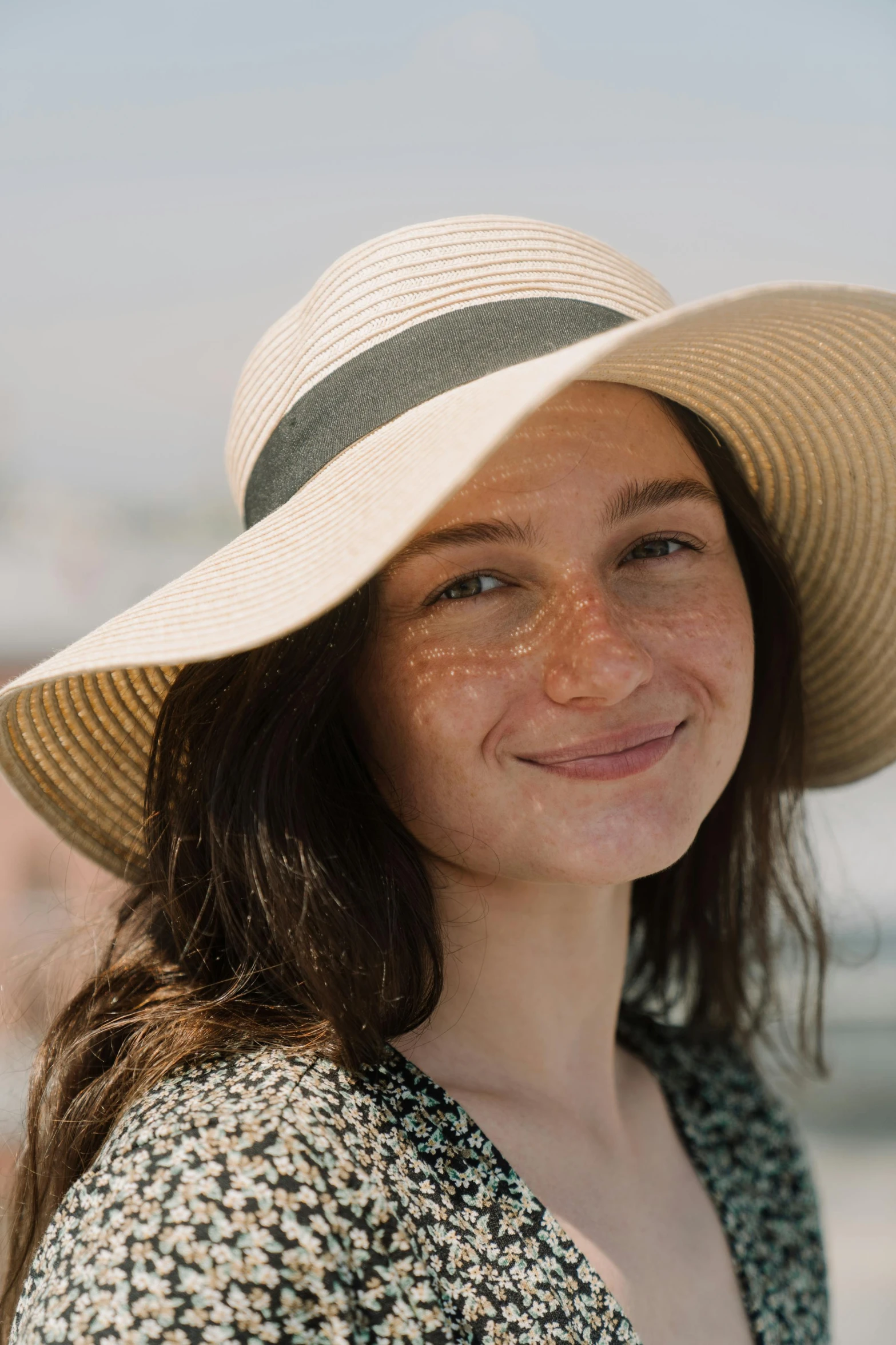 a close up of a person wearing a hat, full sun, portrait of sanna marin, rounded face, fair complexion