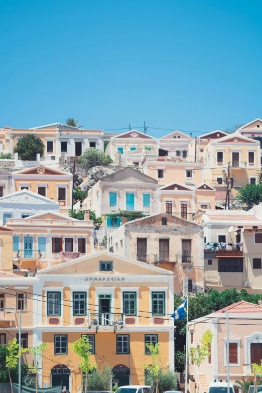 a group of cars parked on the side of a road, neoclassicism, greek architecture, slide show, waterfront houses, multi - coloured