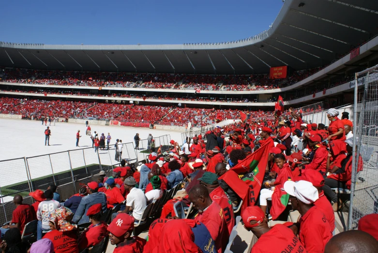 a large crowd of people at a baseball game, inspired by Joze Ciuha, hurufiyya, red cape, capital plaza, n4, winning photograph