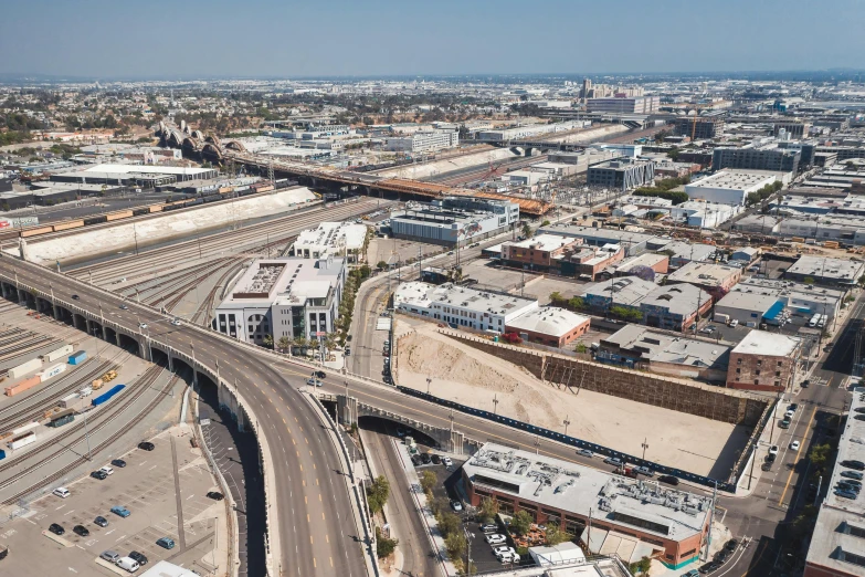 an aerial view of an intersection in a city, by Washington Allston, unsplash, photorealism, los angeles ca, high bridges, 2 0 2 2 photo, bjarke ingels