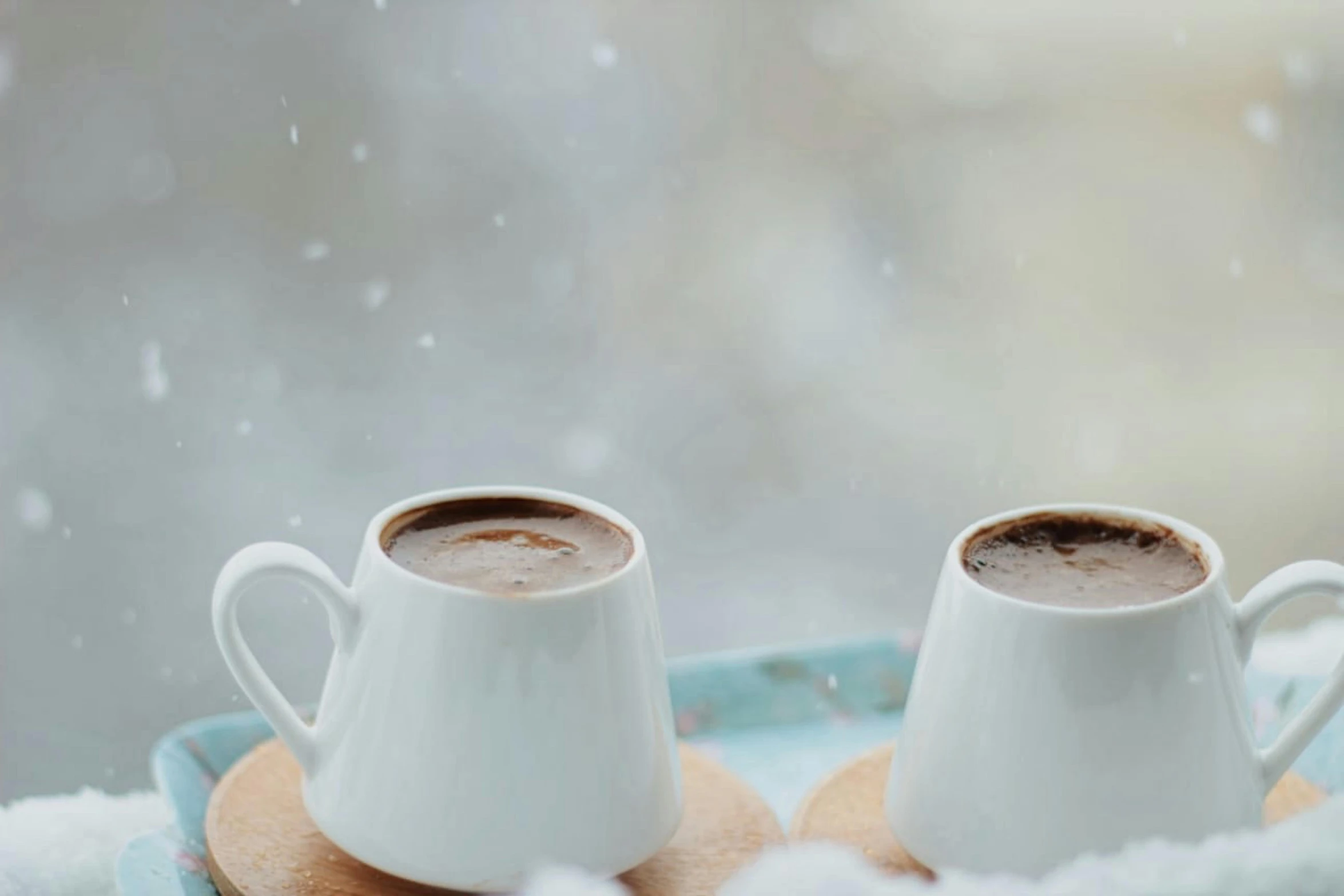 two cups of hot chocolate sit on a tray in the snow, pexels contest winner, hurufiyya, on a white table, background image, alex heywood, middle eastern