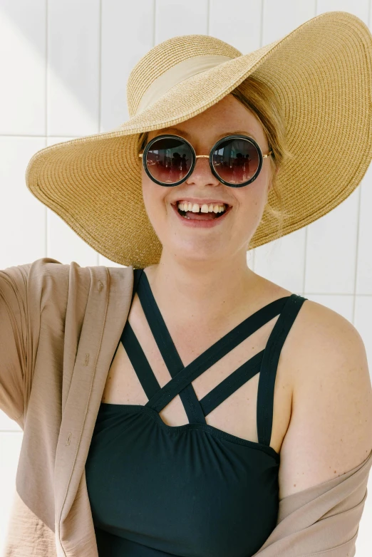 a woman in a hat and sunglasses posing for a picture, swim suite, plus-sized, profile image, large)}]