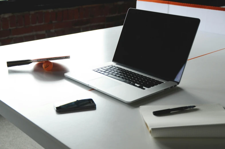 a laptop computer sitting on top of a white table, pexels, 9 9 designs, dark. no text, document photo, maintenance