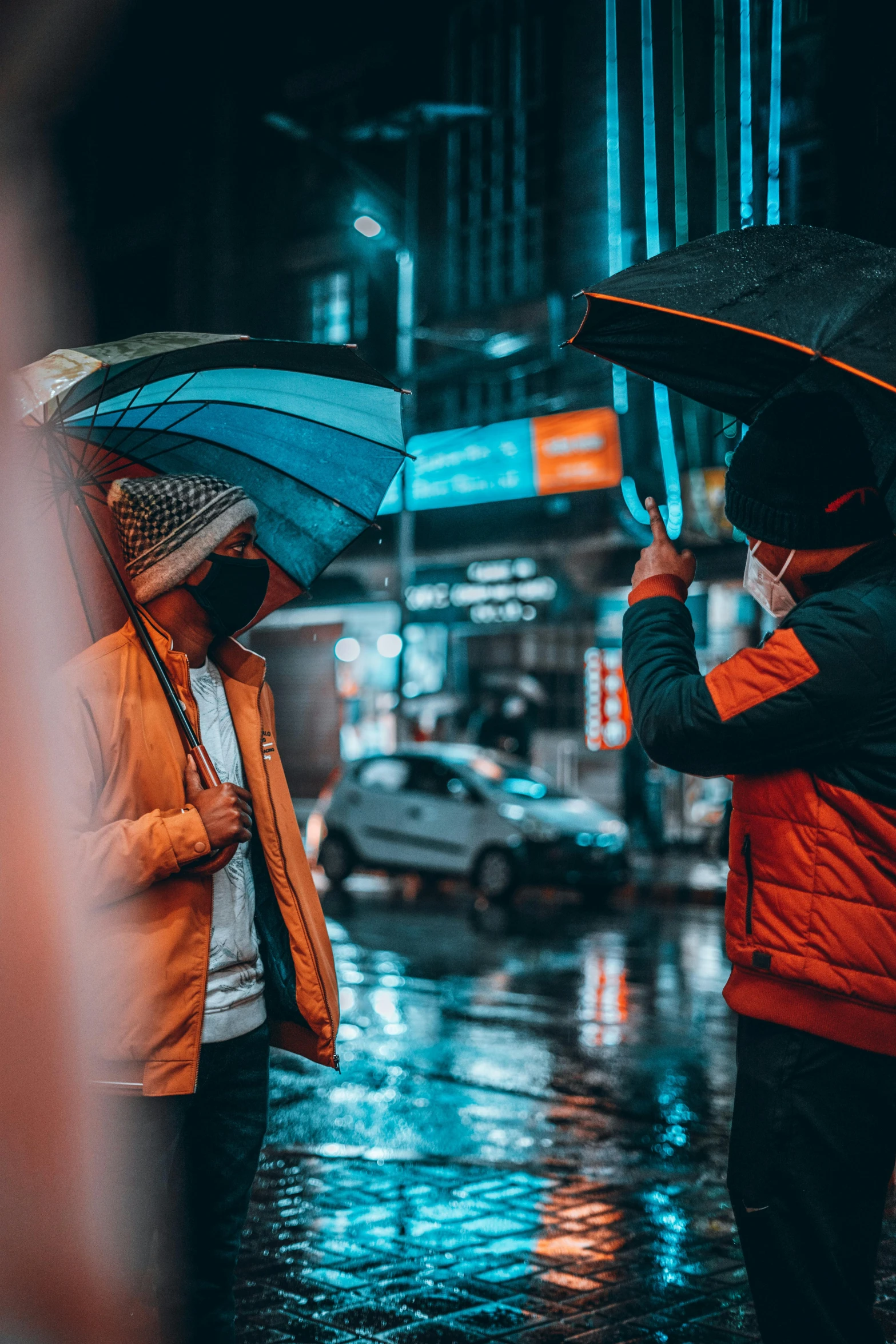 two people standing in the rain with umbrellas, unsplash contest winner, orange and cyan lighting, calmly conversing 8k, people are wearing masks, instagram picture