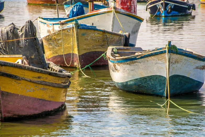 a number of boats in a body of water, a photo, pexels contest winner, process art, colorful caparisons, thumbnail, low colour, stamperia