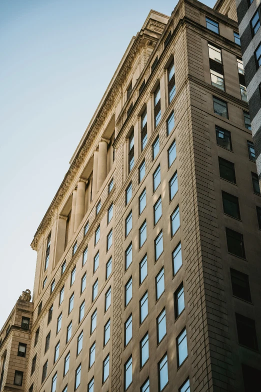 a very tall building with lots of windows, by William Woodward, unsplash, neoclassicism, pittsburgh, high-body detail, sunlit, large overhangs