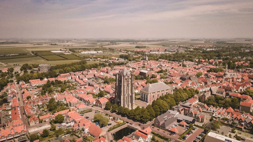 an aerial view of a city with red roofs, a picture, by Jan Tengnagel, pexels contest winner, renaissance, helmond, church, fine art print, brown