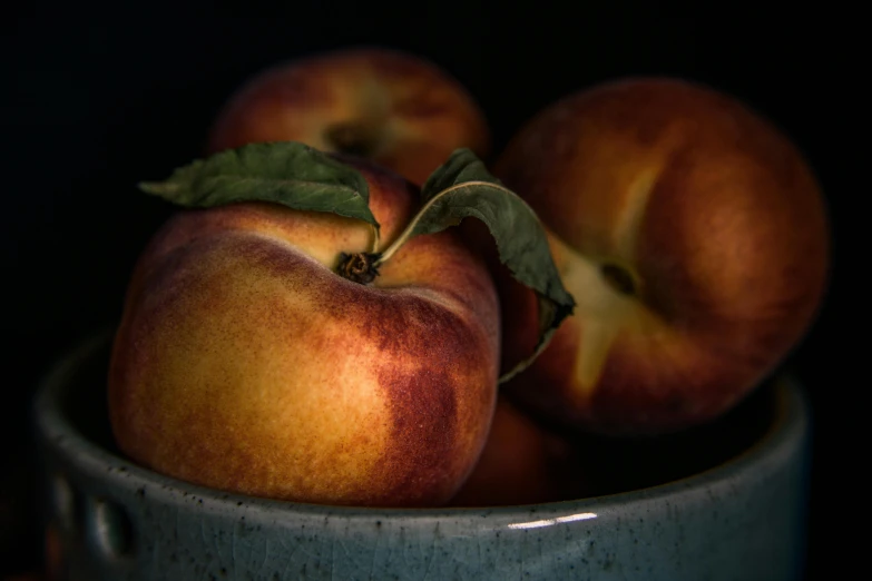 a close up of a bowl of peaches, a still life, inspired by Elsa Bleda, pexels contest winner, paul barson, waist up, zoomed in, lecherous pose