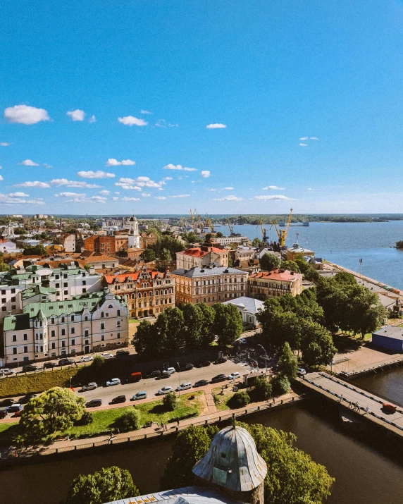 a large body of water next to a city, pexels contest winner, socialist realism, russian city, lgbtq, ultrawide image, watermarked